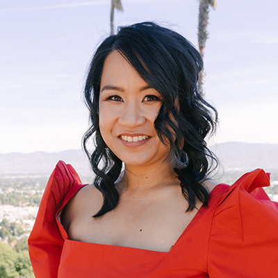 elaine lou cartas smiling in a headshot