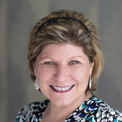 Kathy Murray smiling in her headshot