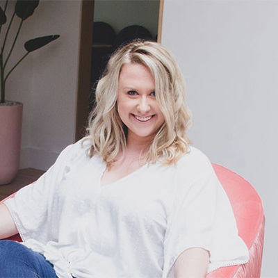 Rebecca Ives smiling in her headshot